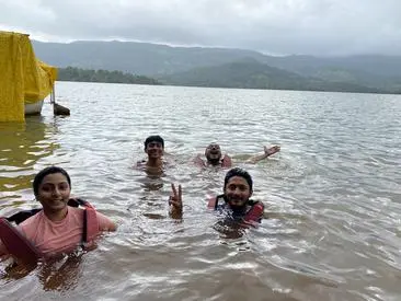 guest enjoying swimming in lake at shivsagar agro tourism tapola